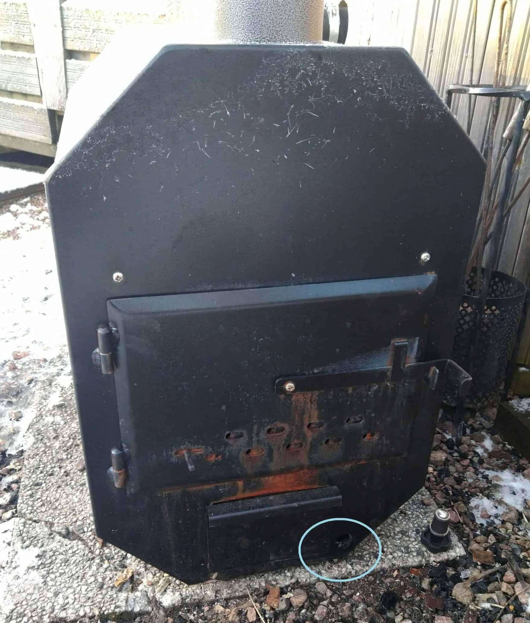 Hot tub stove and the stove drainage opening.